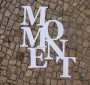 MOMENT. Logo